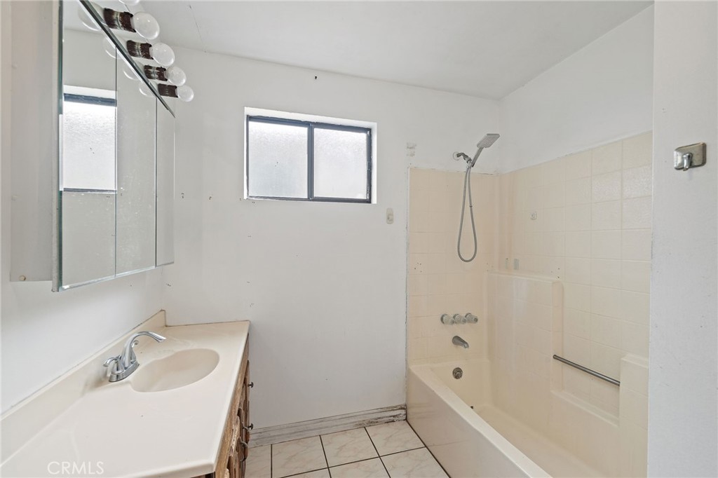 4761 West 141st Street Hawthorne, CA 90250 - Photo 16 of 29 a bathroom with a sink toilet and shower