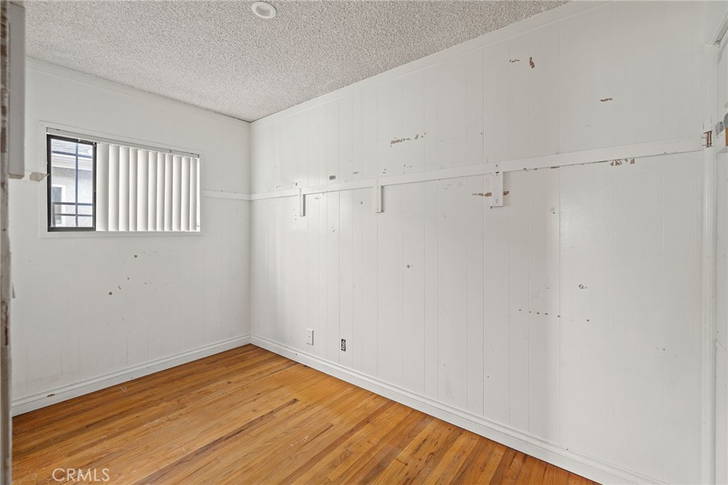 4761 West 141st Street Hawthorne, CA 90250 - Photo 19 of 29 a view of a room with wooden floor and cabinet