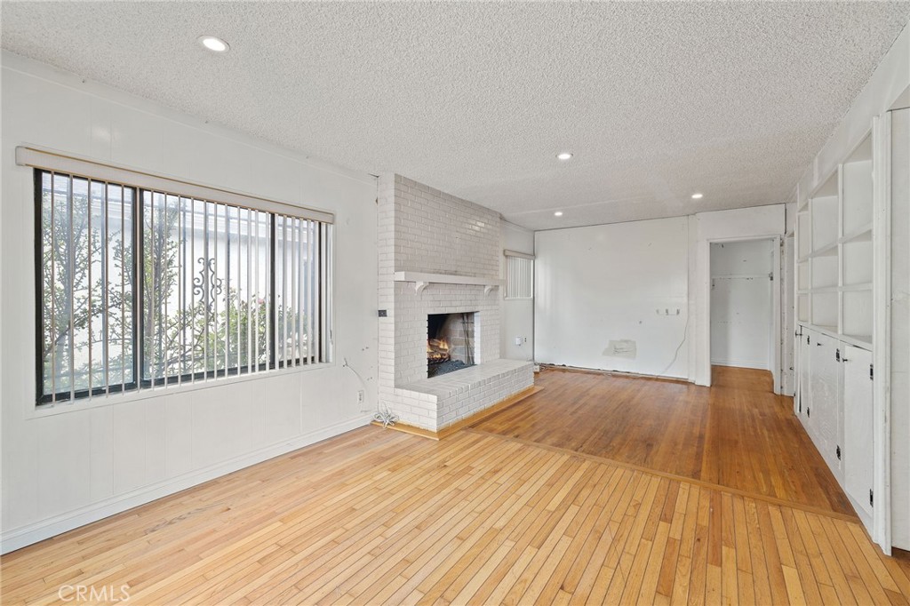 4761 West 141st Street Hawthorne, CA 90250 - Photo 2 of 29 a view of an empty room with wooden floor and a window