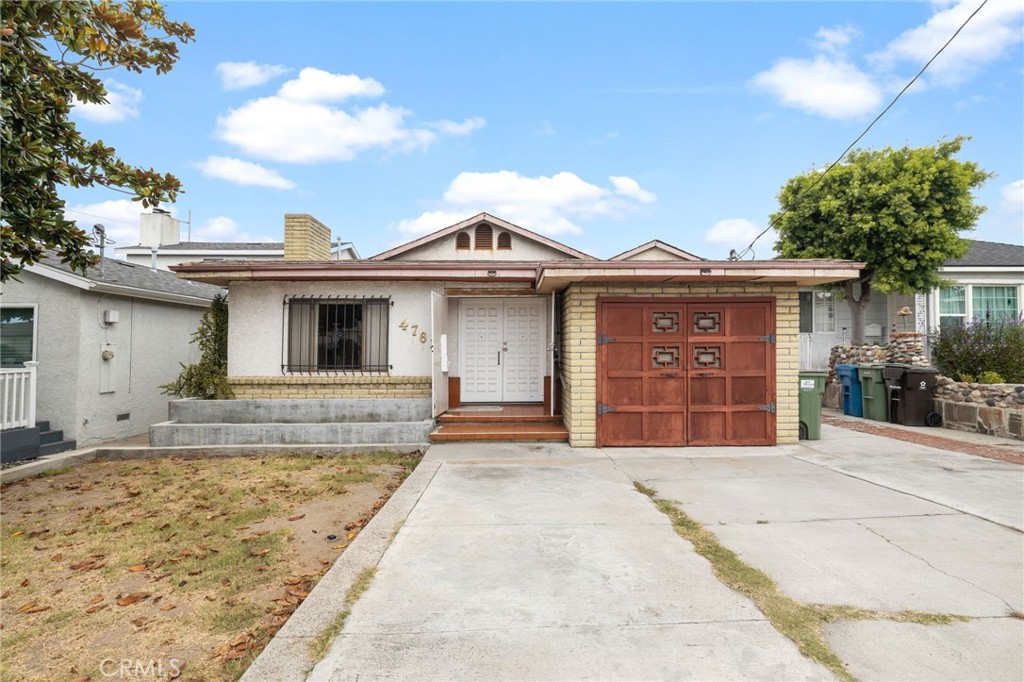 4761 West 141st Street Hawthorne, CA 90250 - Photo 28 of 29 a front view of a house with a garden