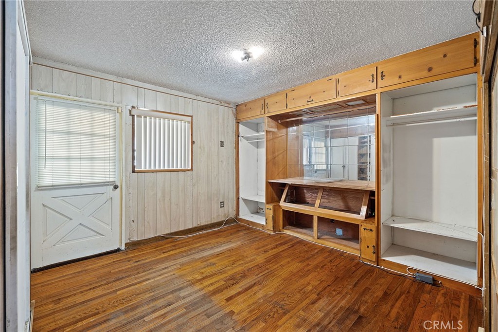4761 West 141st Street Hawthorne, CA 90250 - Photo 8 of 29 an empty room with wooden floor closet and windows