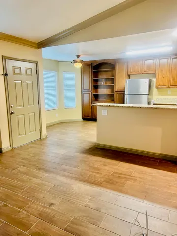 a view of kitchen with wooden floor