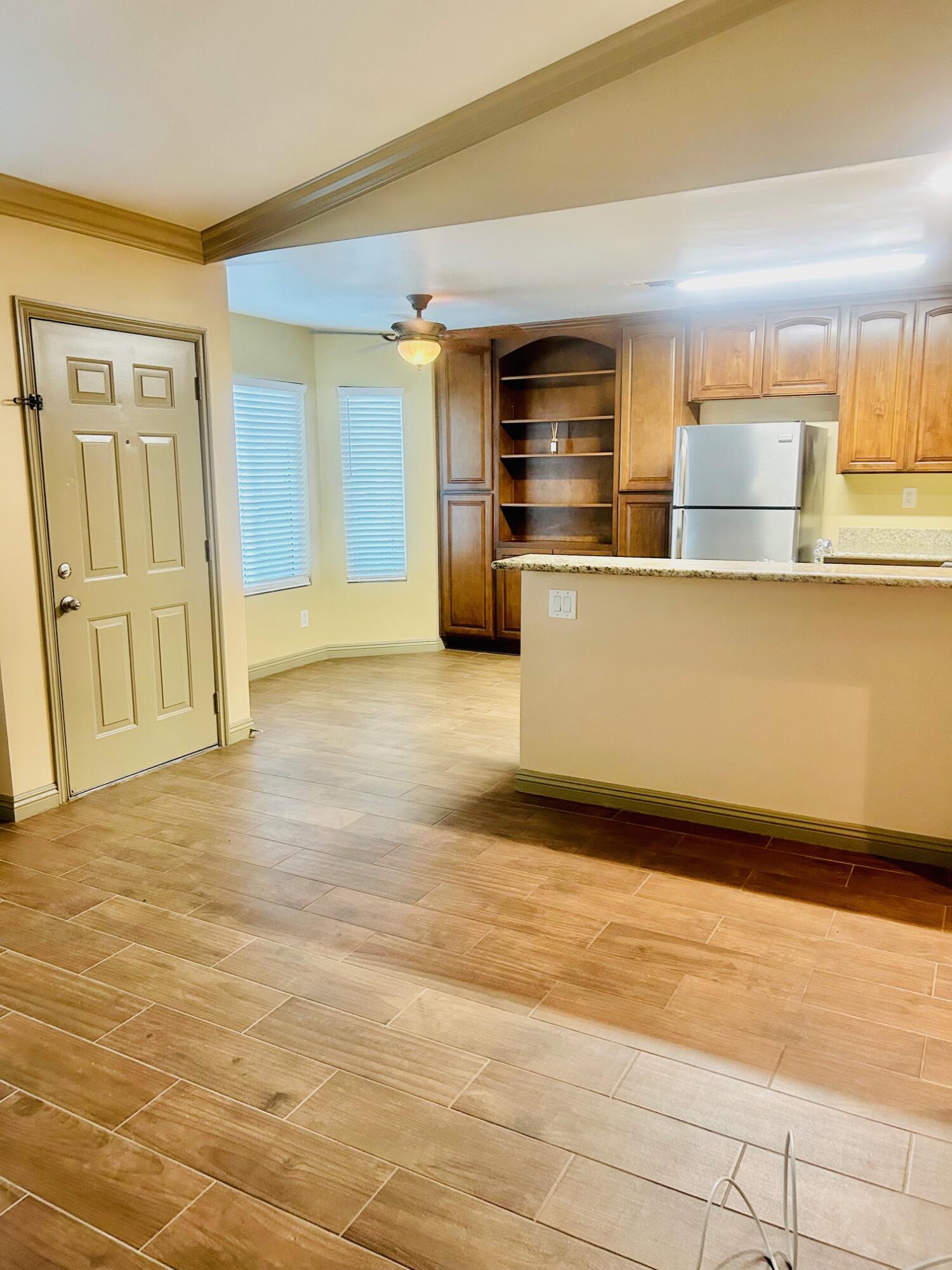 40780 Breezy Pass Road, Unit B Palm Desert, CA 92211 - Photo 11 of 32 a view of kitchen with wooden floor