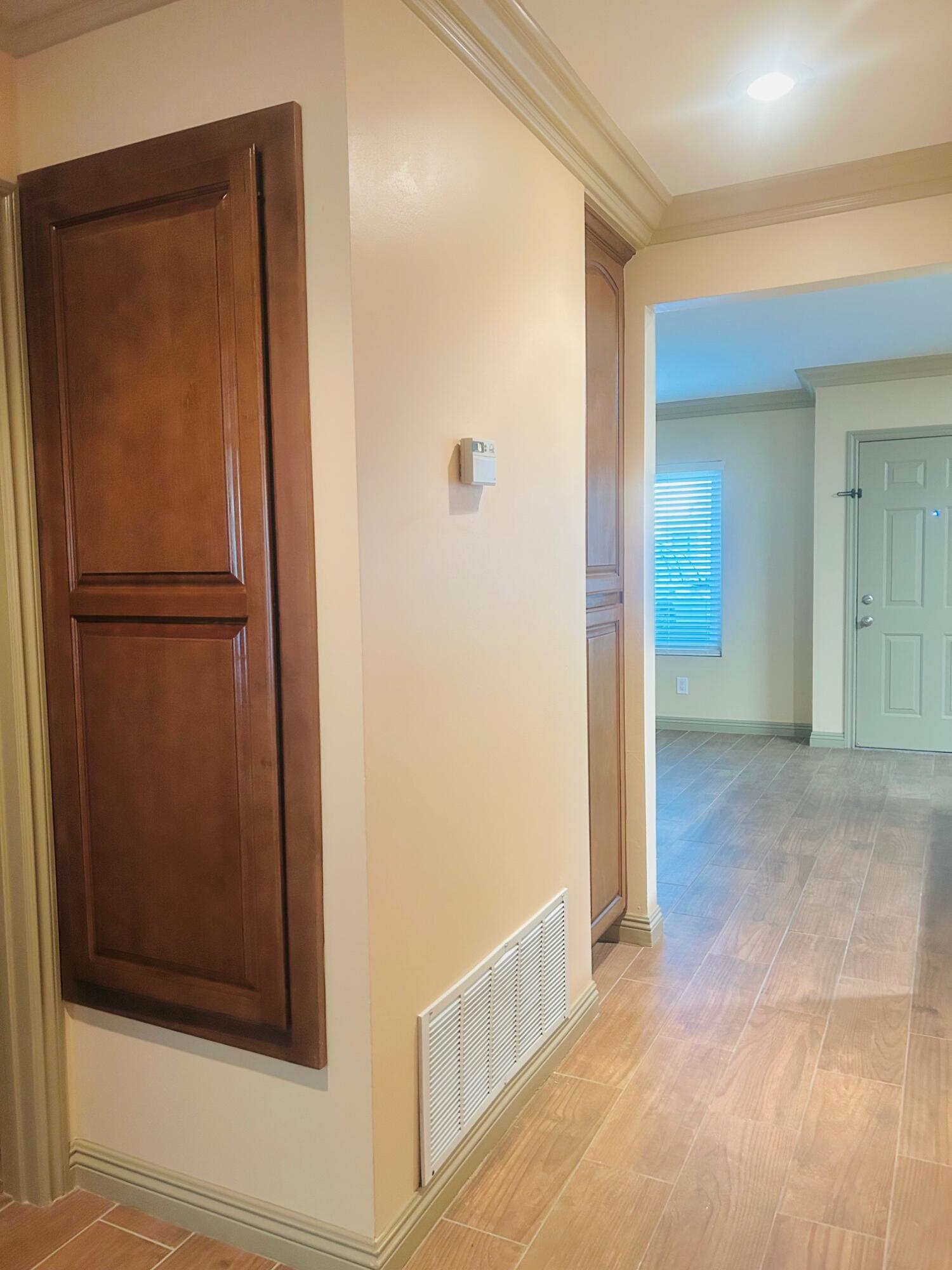 40780 Breezy Pass Road, Unit B Palm Desert, CA 92211 - Photo 17 of 32 a view of a hallway with wooden floor