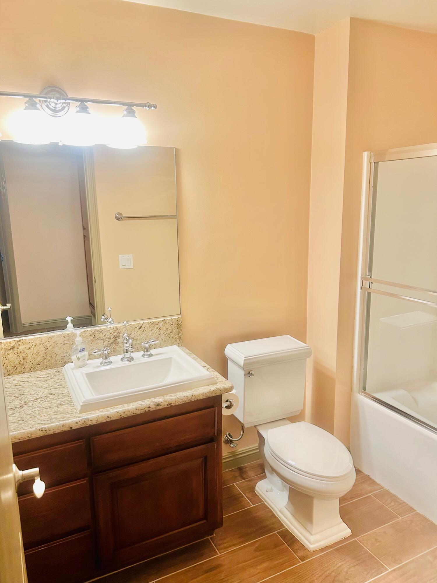 40780 Breezy Pass Road, Unit B Palm Desert, CA 92211 - Photo 18 of 32 a bathroom with a sink and a toilet