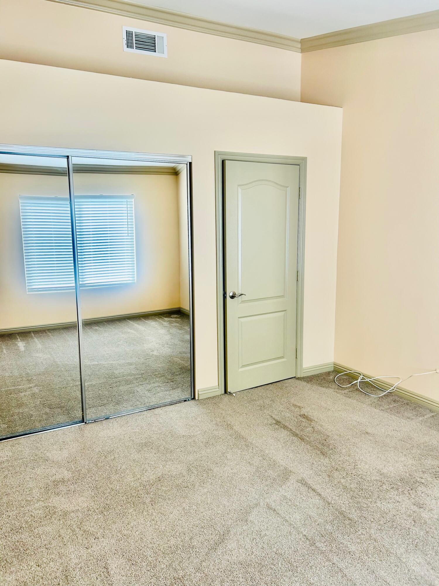 40780 Breezy Pass Road, Unit B Palm Desert, CA 92211 - Photo 21 of 32 an empty room with a ceiling fan