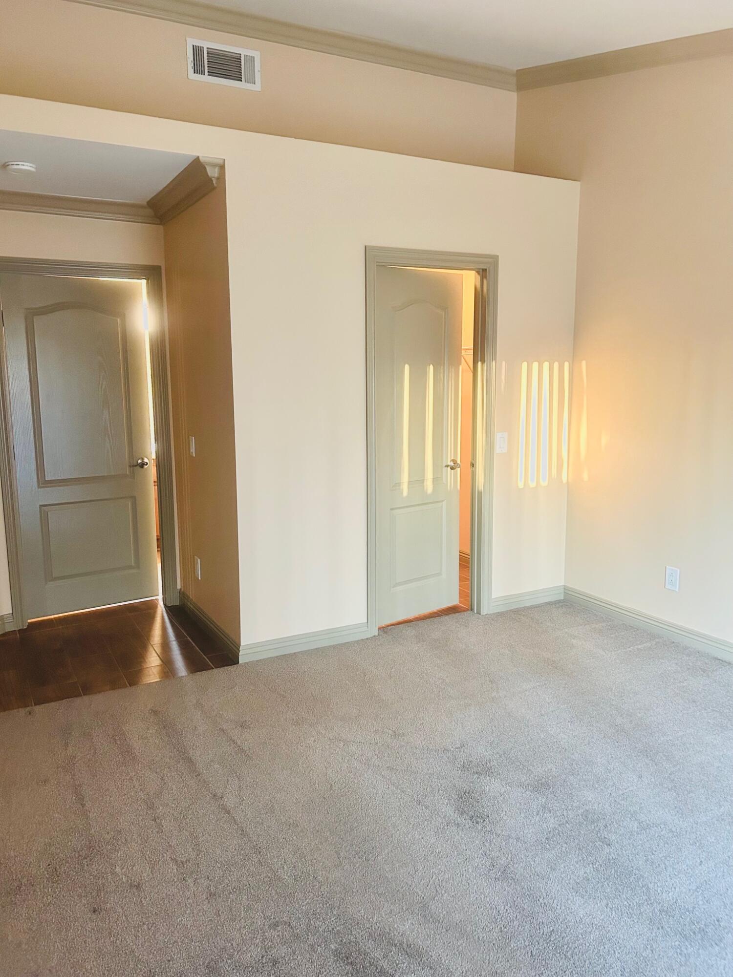 40780 Breezy Pass Road, Unit B Palm Desert, CA 92211 - Photo 25 of 32 an empty room with windows and mirror
