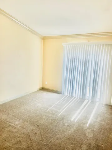 an empty room with an empty space and a window