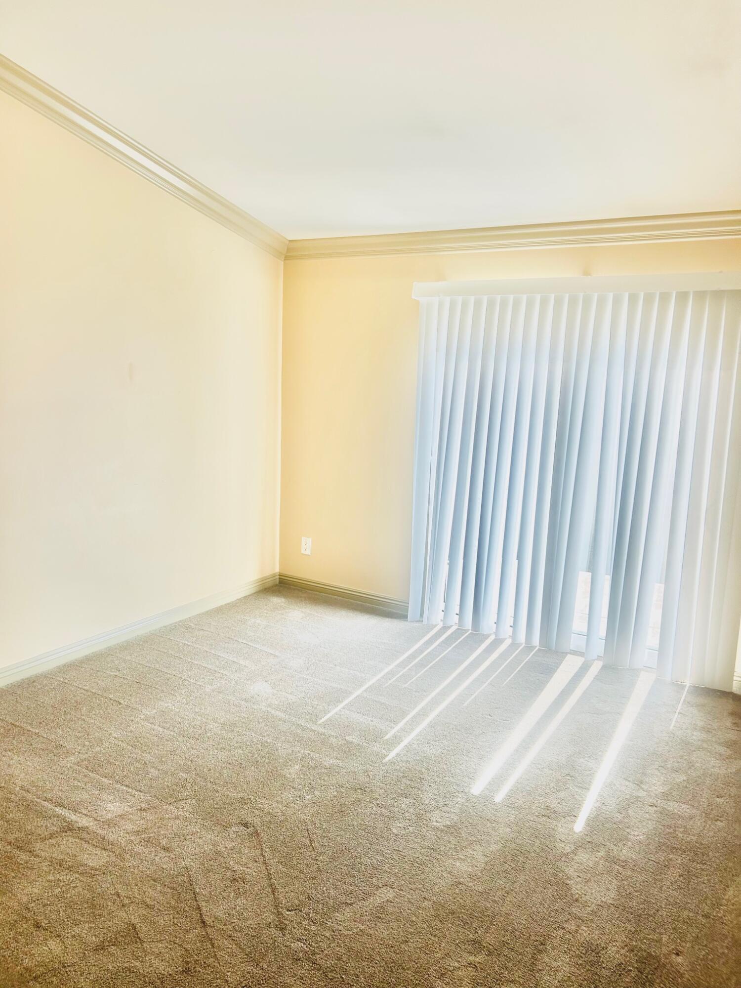 40780 Breezy Pass Road, Unit B Palm Desert, CA 92211 - Photo 26 of 32 an empty room with an empty space and a window