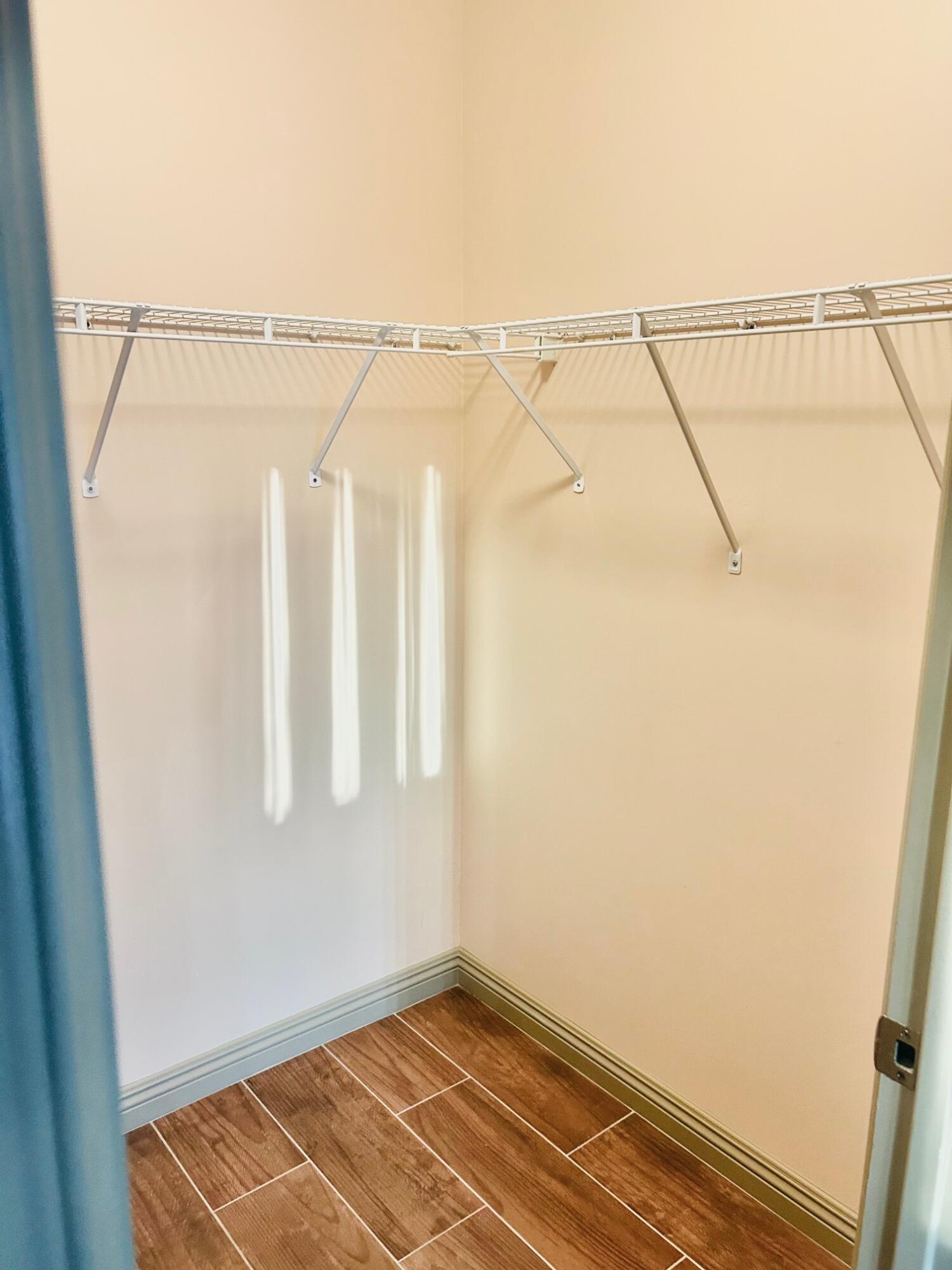 40780 Breezy Pass Road, Unit B Palm Desert, CA 92211 - Photo 28 of 32 a view of a room with rack on the wall