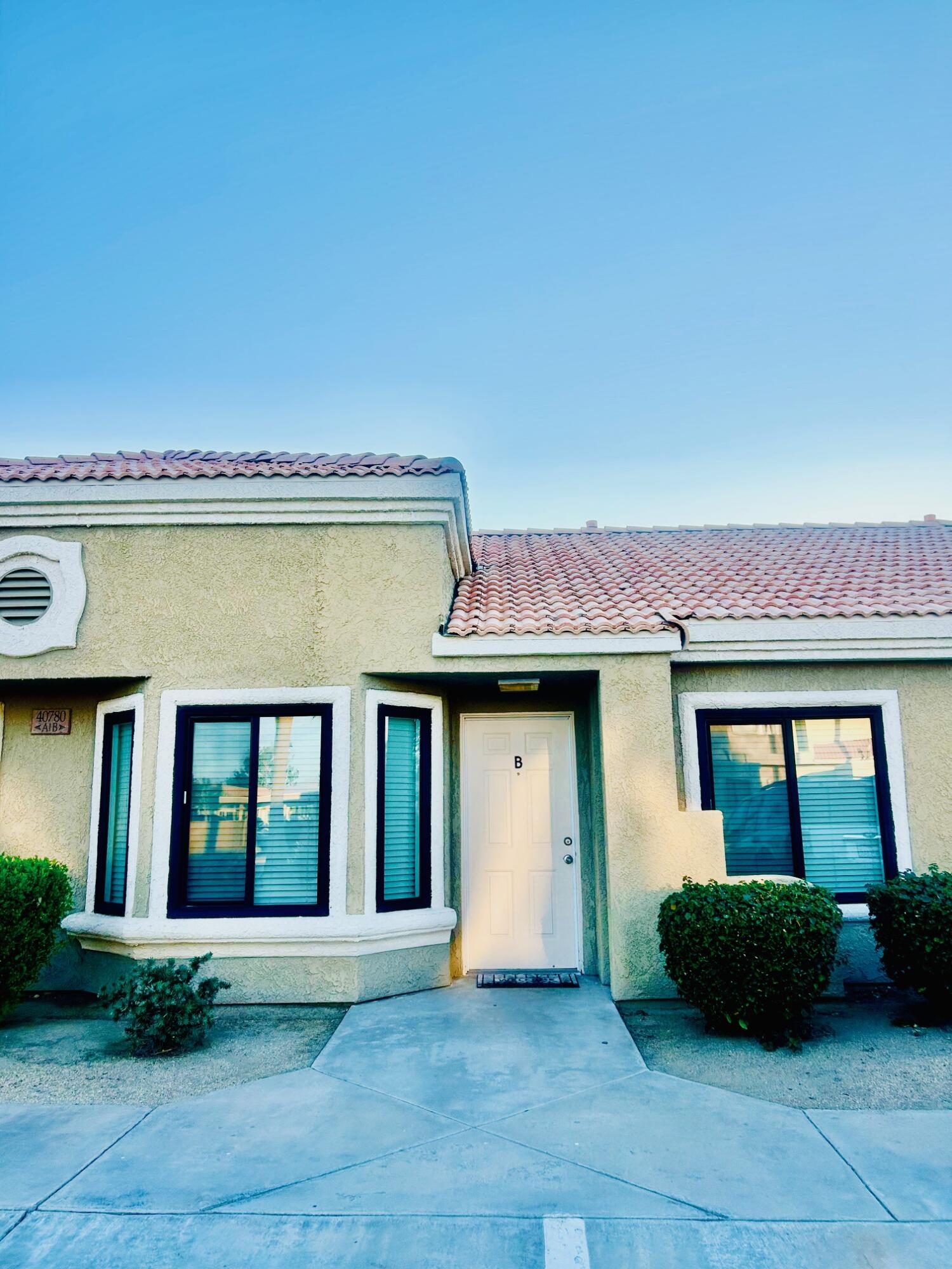 40780 Breezy Pass Road, Unit B Palm Desert, CA 92211 - Photo 3 of 32 a front view of a house