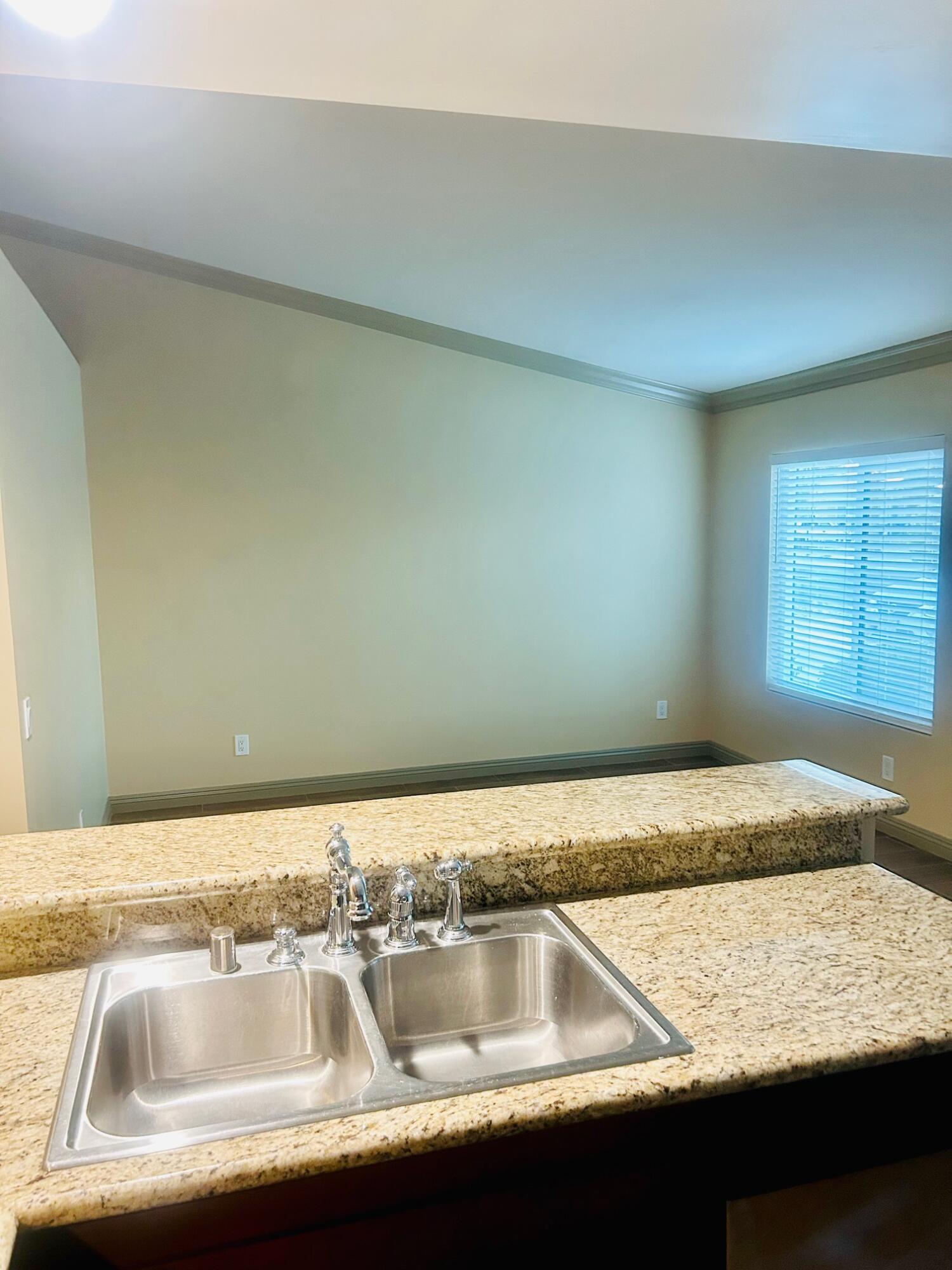 40780 Breezy Pass Road, Unit B Palm Desert, CA 92211 - Photo 8 of 32 a close view of sink and tap