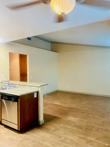 a kitchen with a stove and a sink