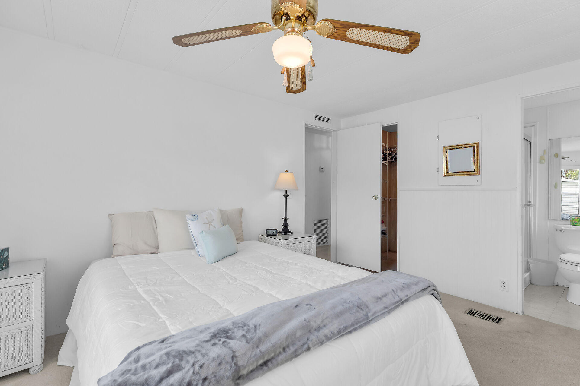 812 South Silver Circle Key Largo, FL 33037 - Photo 15 of 41 a bedroom with a bed and a chandelier