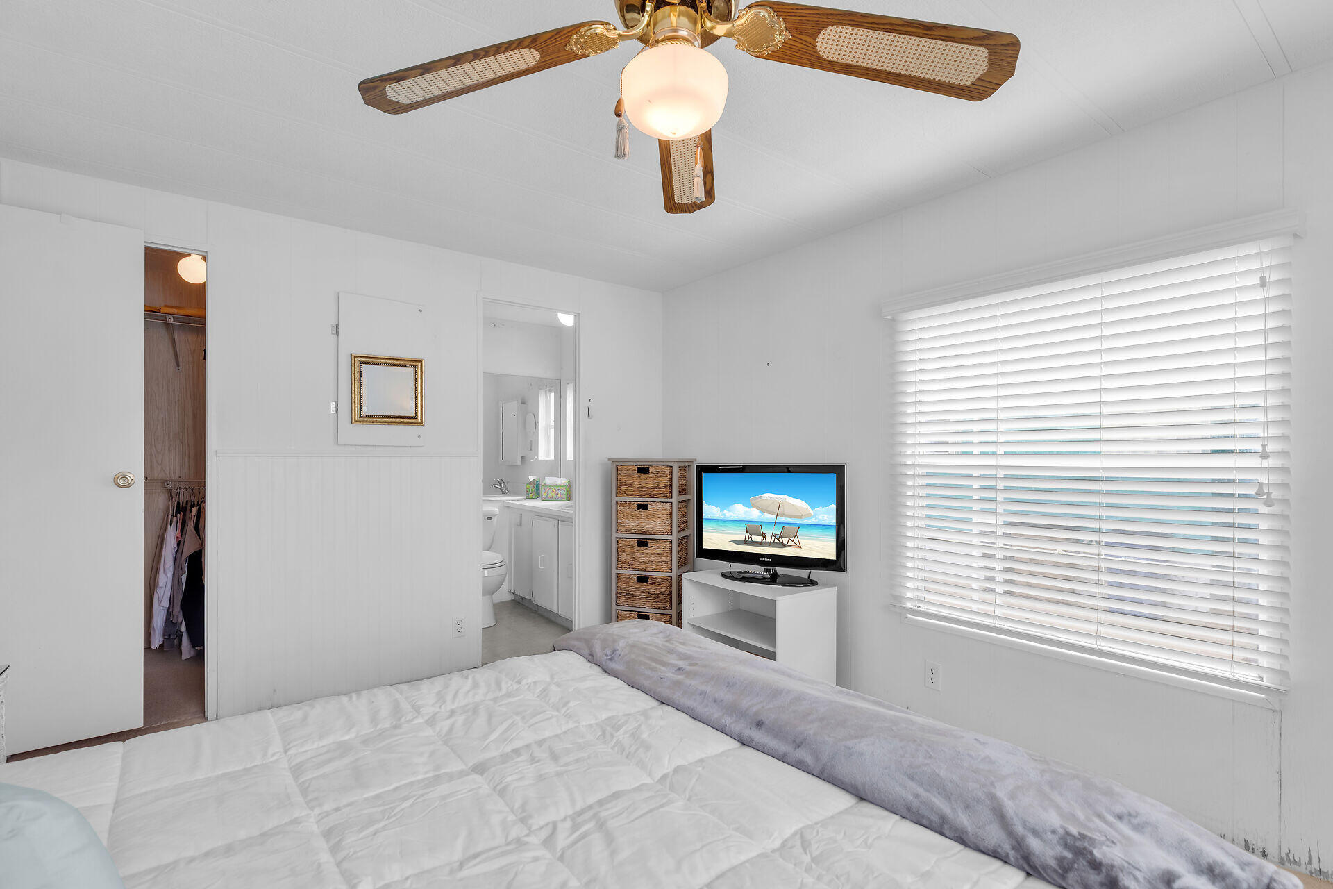812 South Silver Circle Key Largo, FL 33037 - Photo 16 of 41 a bedroom with a bed and a flat screen tv