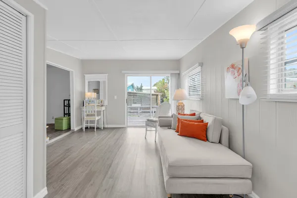 a bedroom with furniture and wooden floor