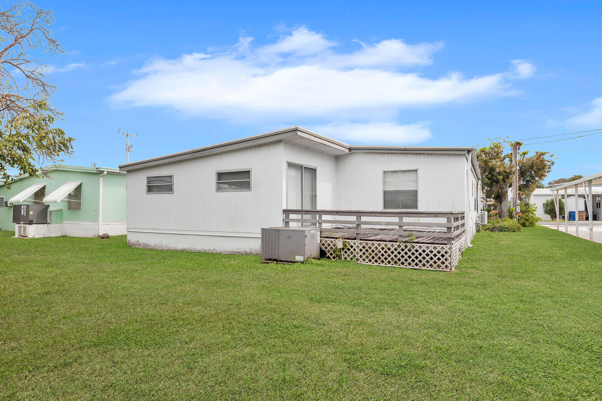 812 South Silver Circle Key Largo, FL 33037 - Photo 26 of 41 a view of a house with a yard and deck