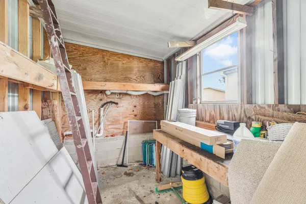 a bathroom with a granite countertop sink a toilet and a mirror