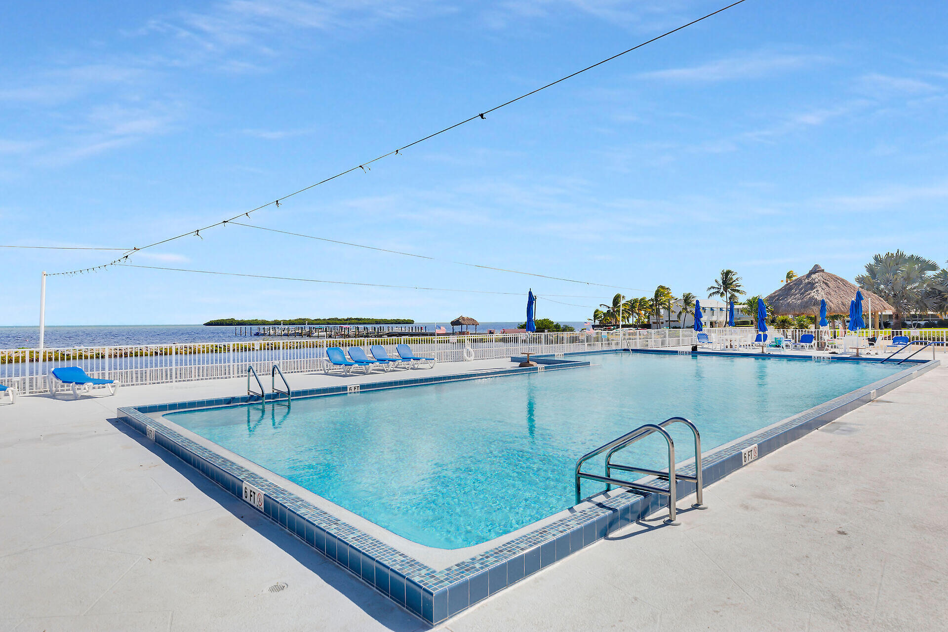 812 South Silver Circle Key Largo, FL 33037 - Photo 35 of 41 a view of a swimming pool with outdoor seating and a lake view