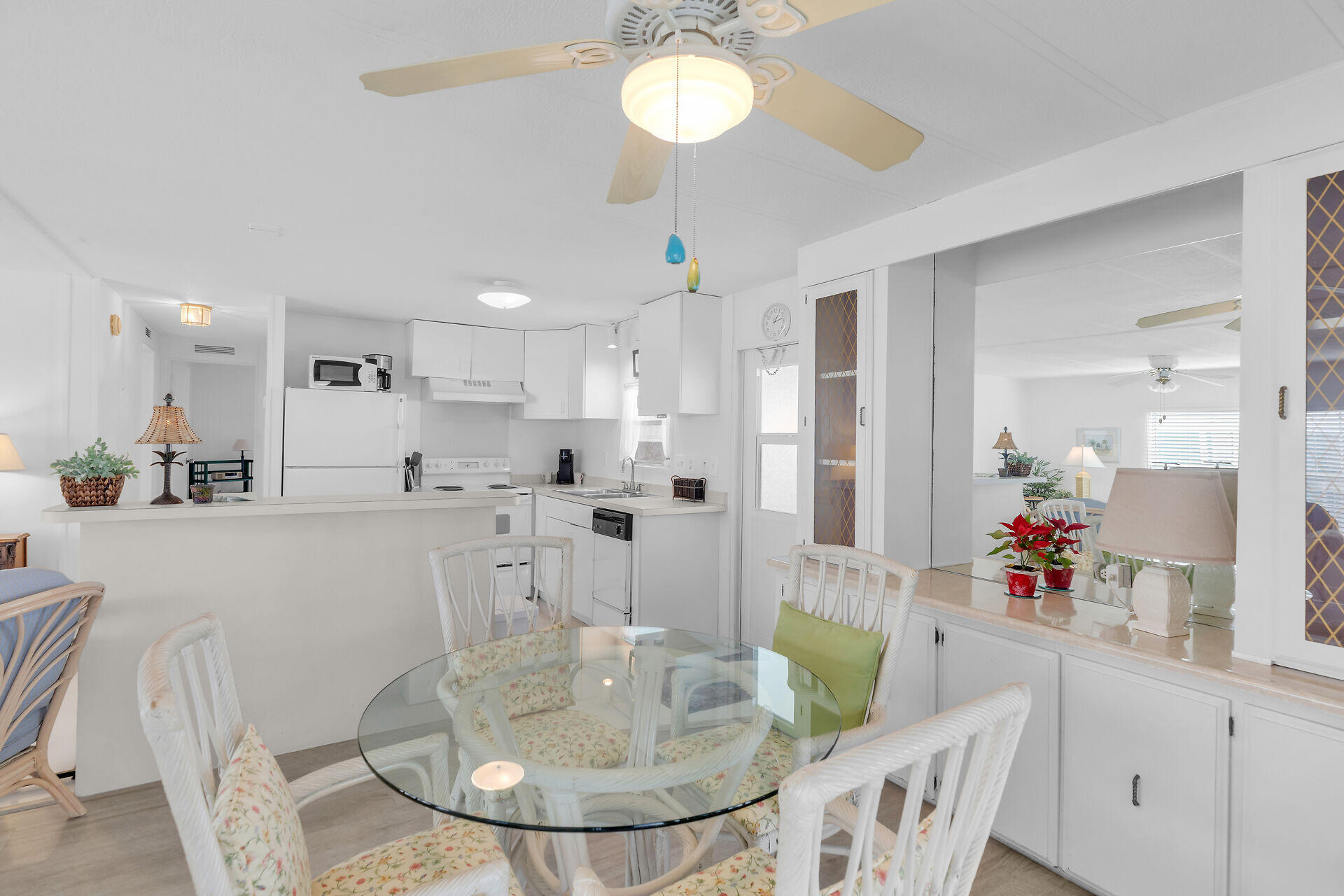 812 South Silver Circle Key Largo, FL 33037 - Photo 4 of 41 a dining room with furniture a chandelier and kitchen view