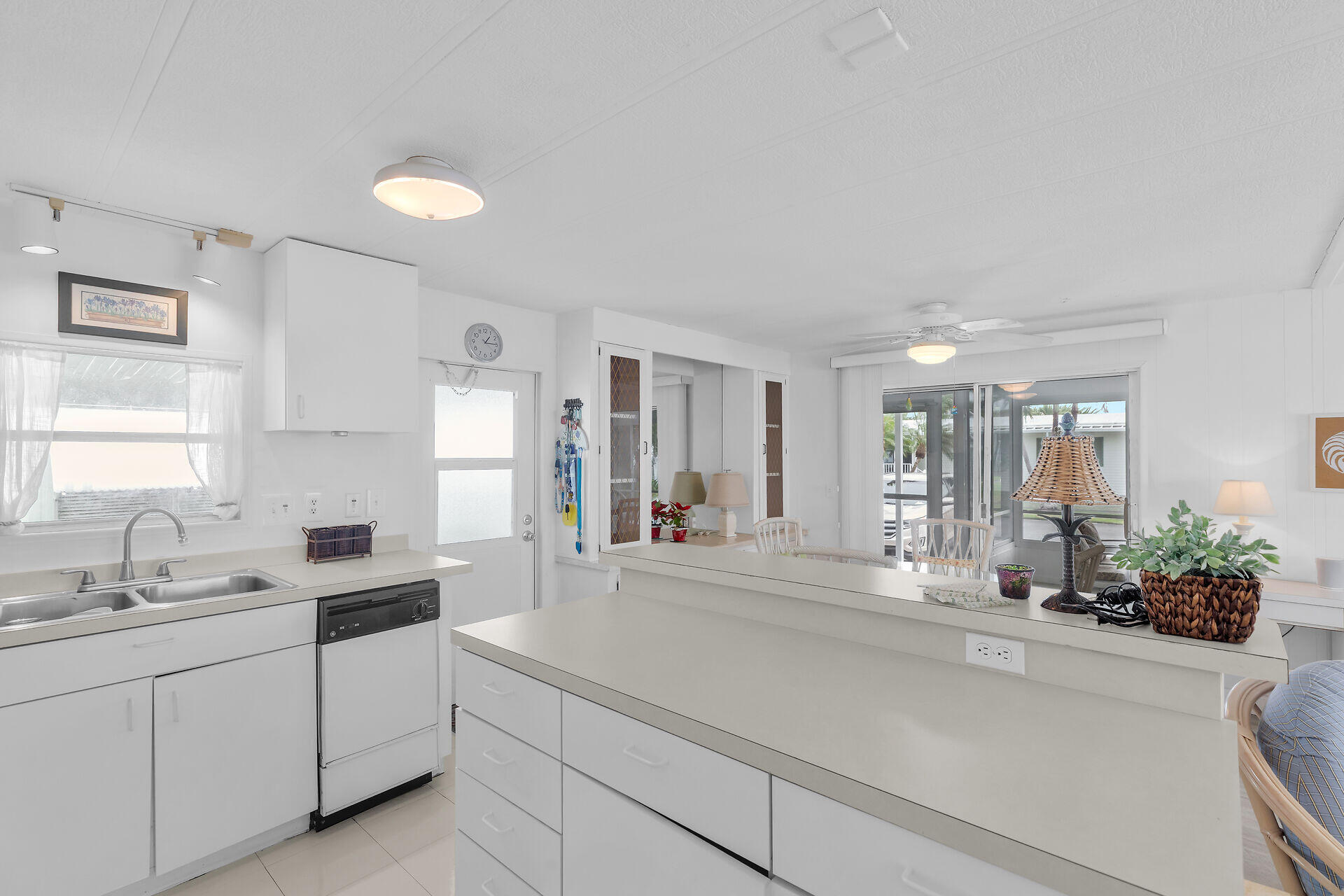 812 South Silver Circle Key Largo, FL 33037 - Photo 6 of 41 a large white kitchen with sink and window
