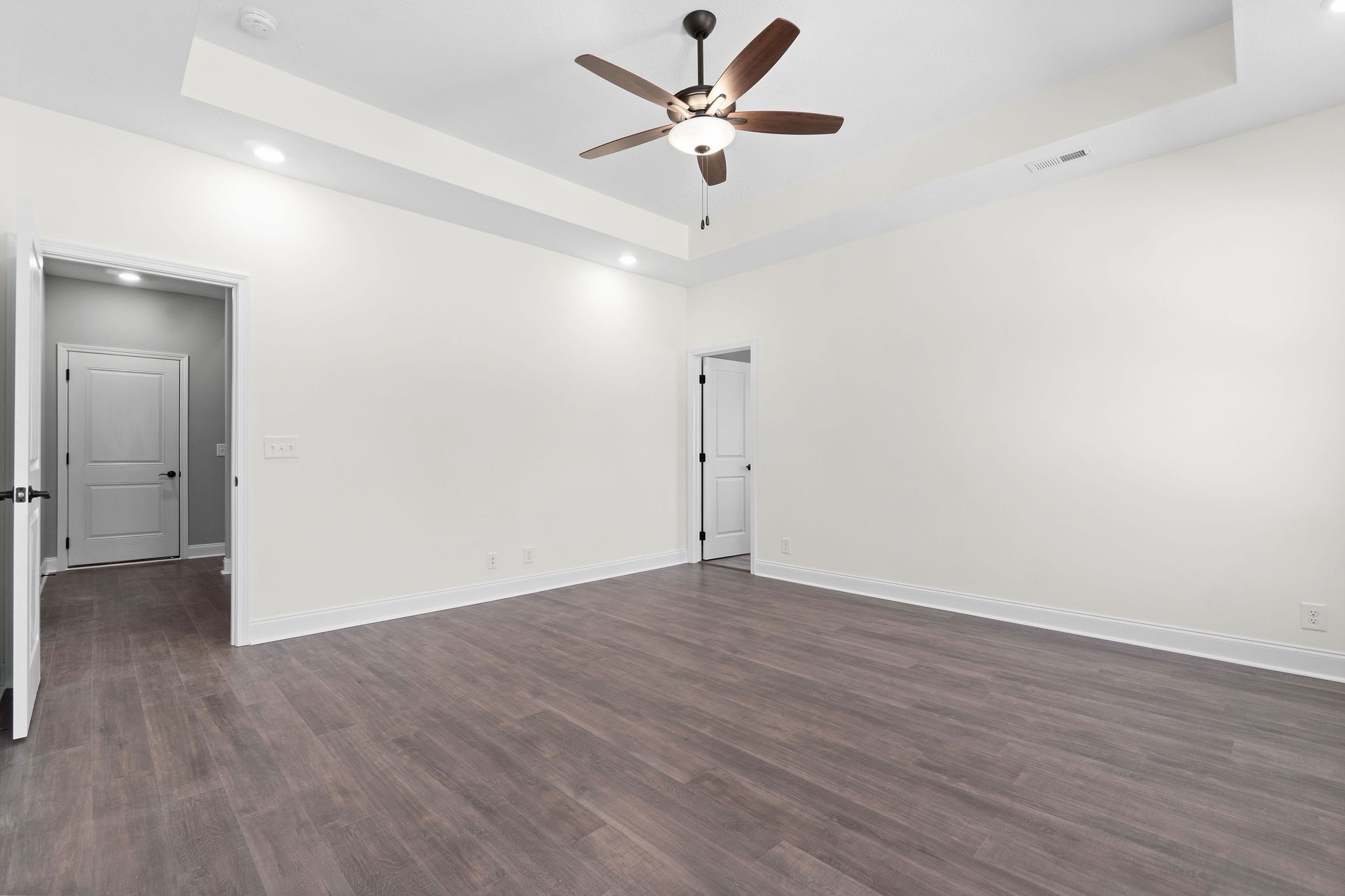 1353 Southside Road Southside, TN 37171 - Photo 22 of 35 an empty room with wooden floor and a ceiling fan