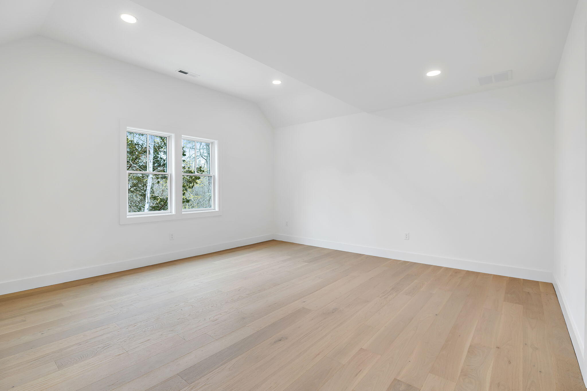 66 Doane Road Harwich Port, MA 02646 - Photo 13 of 40 an empty room with wooden floor and windows