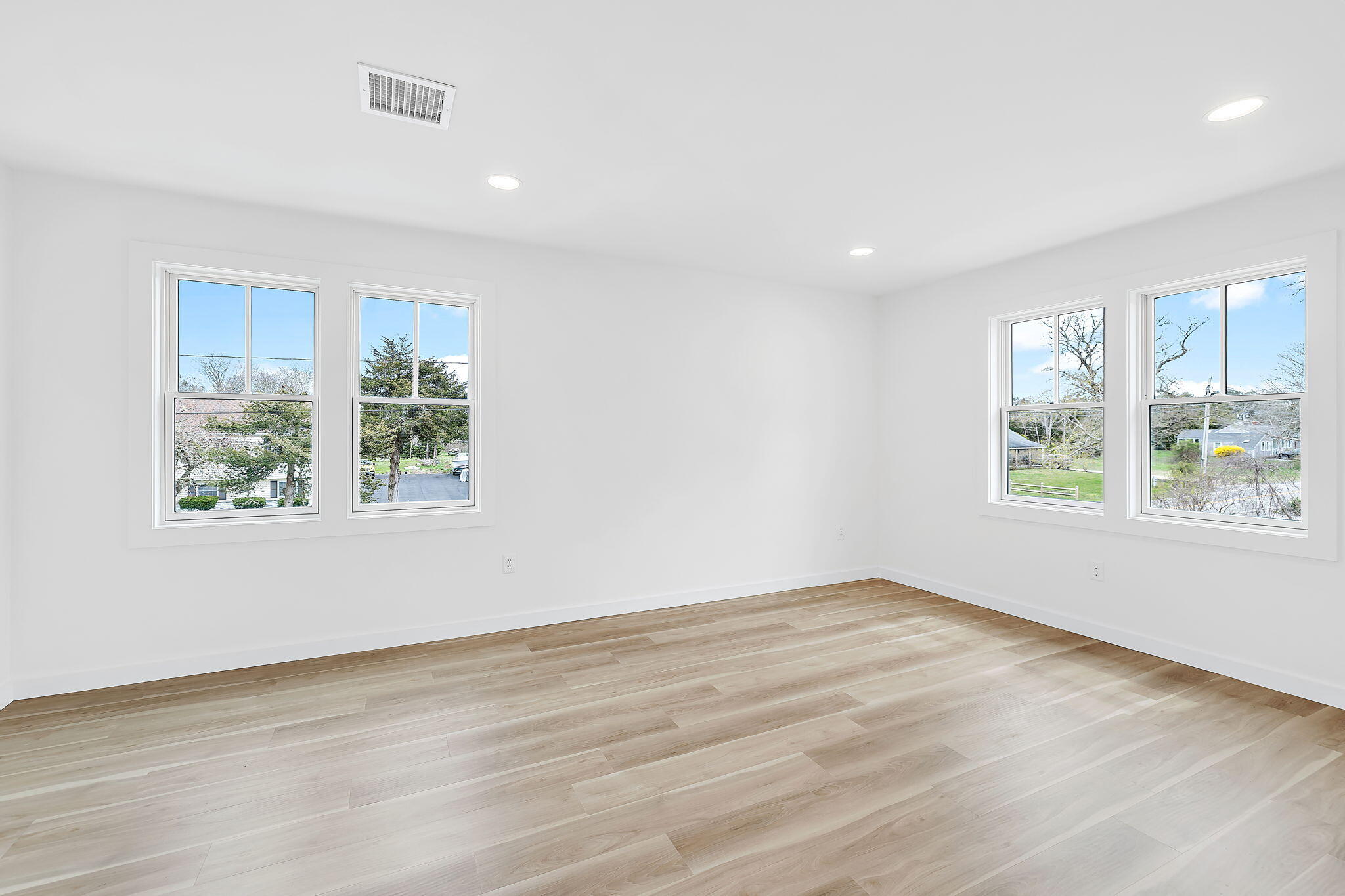 66 Doane Road Harwich Port, MA 02646 - Photo 29 of 40 an empty room with wooden floor and windows