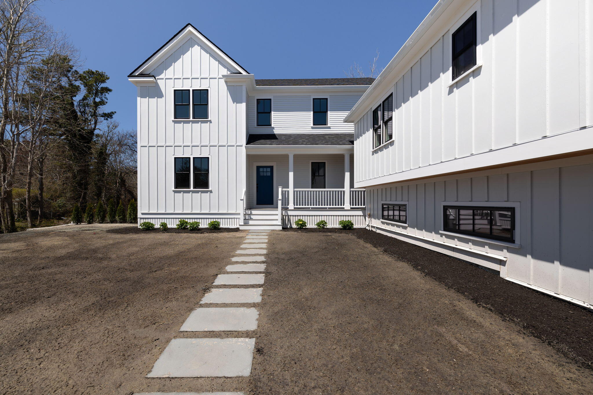 66 Doane Road Harwich Port, MA 02646 - Photo 38 of 40 a view of a white house with a yard