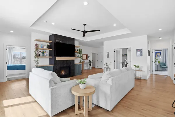 a living room with fireplace furniture and a flat screen tv