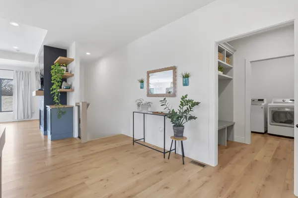 a view of a kitchen and an empty room