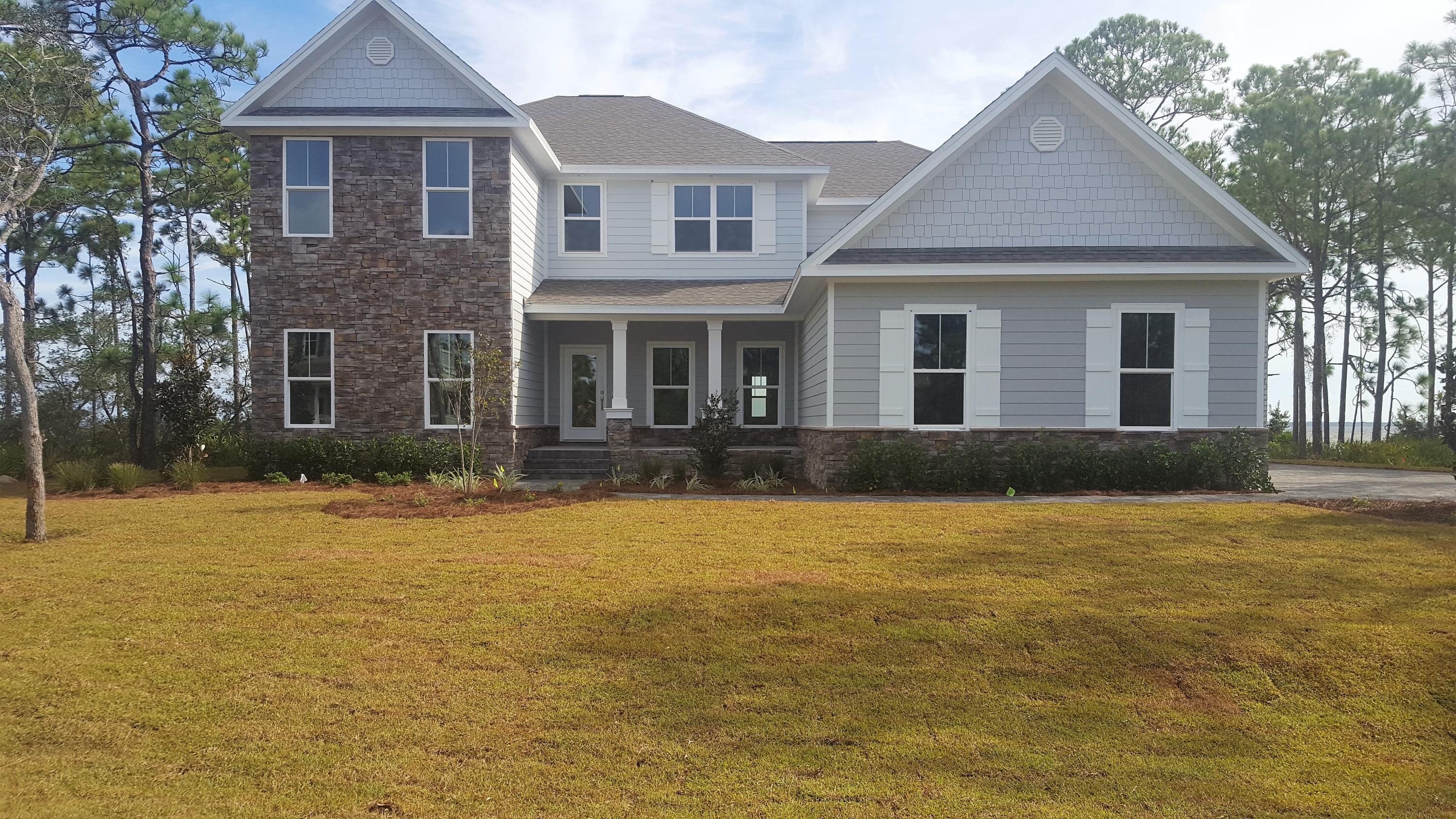 1477 Driftwood Point Road Santa Rosa Beach, FL 32459 - Photo 1 of 15 a front view of a house with a yard