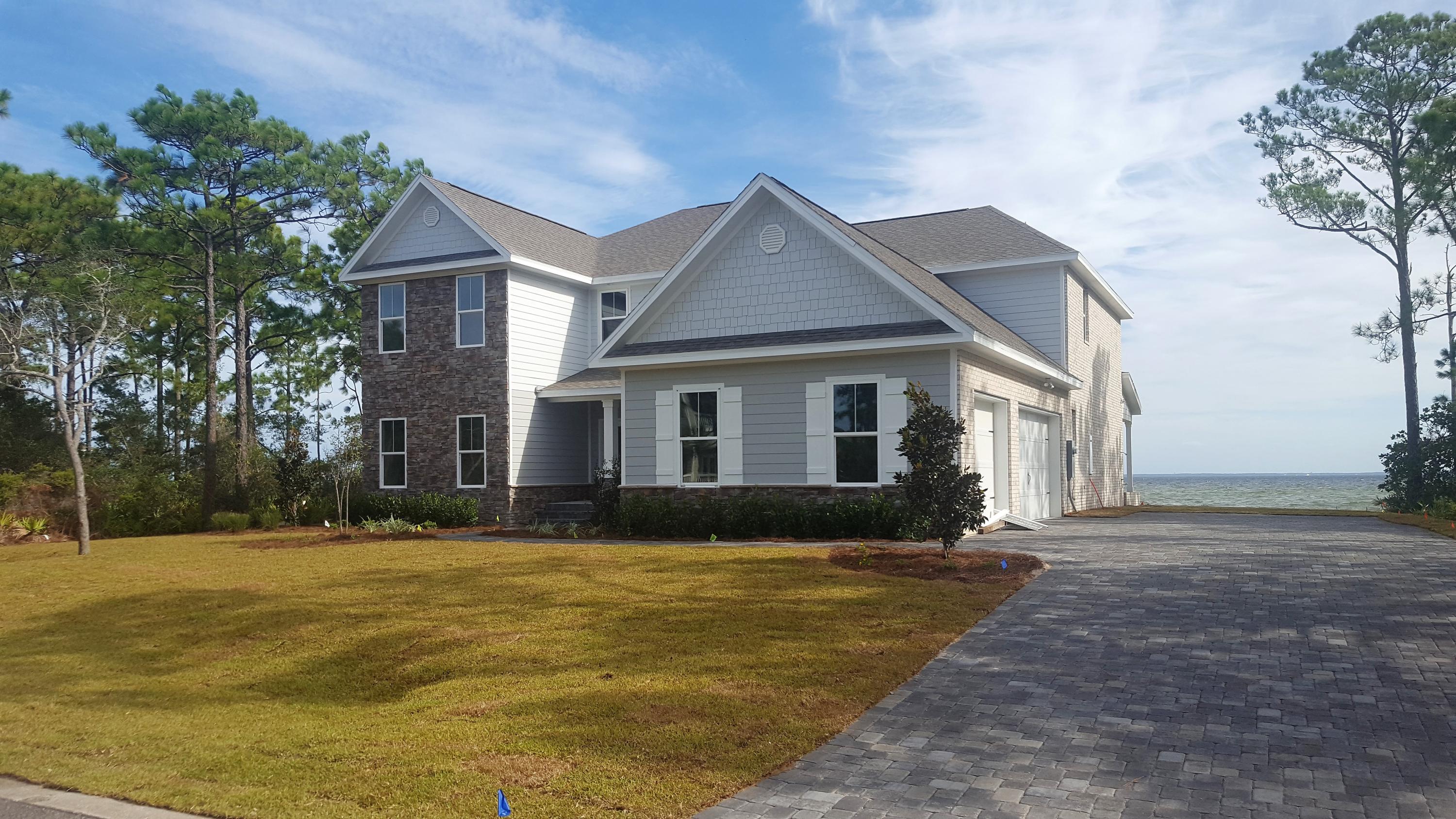 1477 Driftwood Point Road Santa Rosa Beach, FL 32459 - Photo 2 of 15 a front view of a house with a yard
