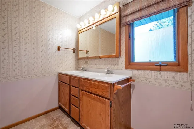 a bathroom with a sink and a mirror