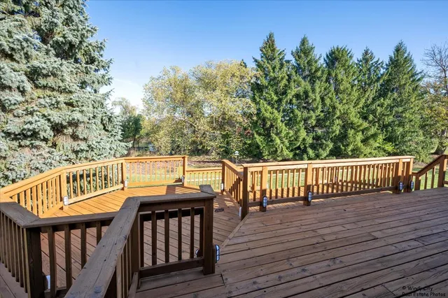 a view of deck with wooden floor and outdoor seating