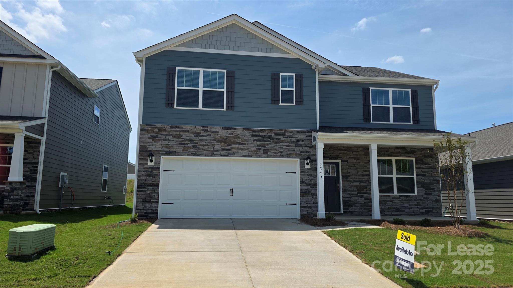 1345 Secrest Cmns Drive Monroe, NC 28112 - Photo 1 of 19 a front view of a house with a yard