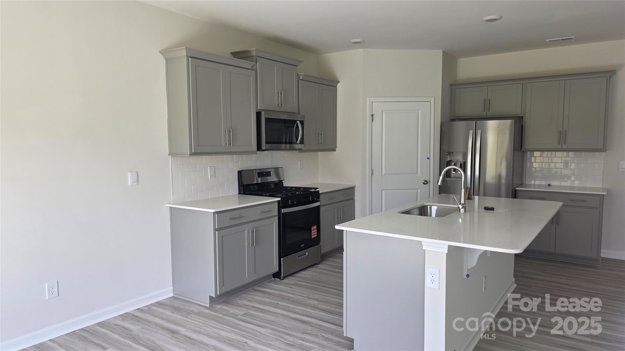 1345 Secrest Cmns Drive Monroe, NC 28112 - Photo 4 of 19 a kitchen with a sink stove and refrigerator