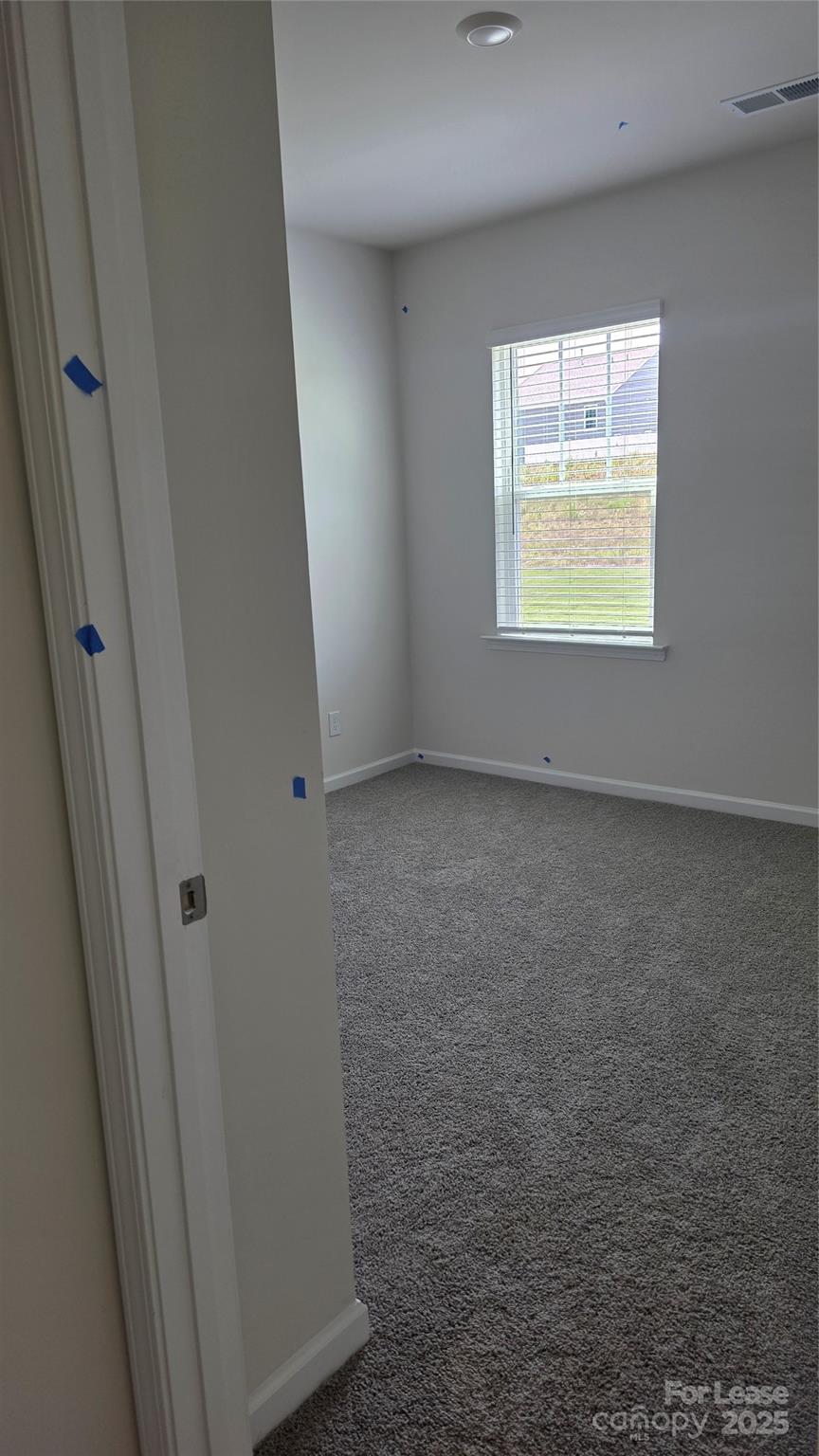 1345 Secrest Cmns Drive Monroe, NC 28112 - Photo 7 of 19 an empty room with windows