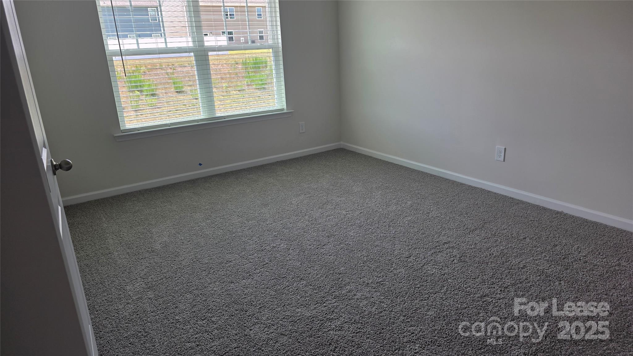 1345 Secrest Cmns Drive Monroe, NC 28112 - Photo 10 of 19 an empty room with a window