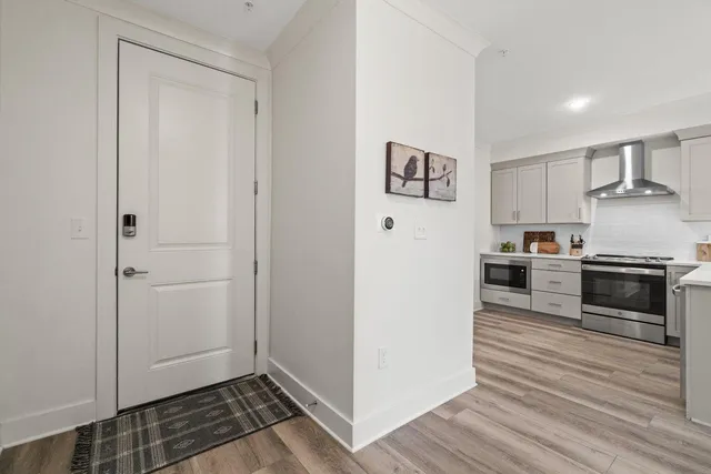 a kitchen with granite countertop a refrigerator and a stove