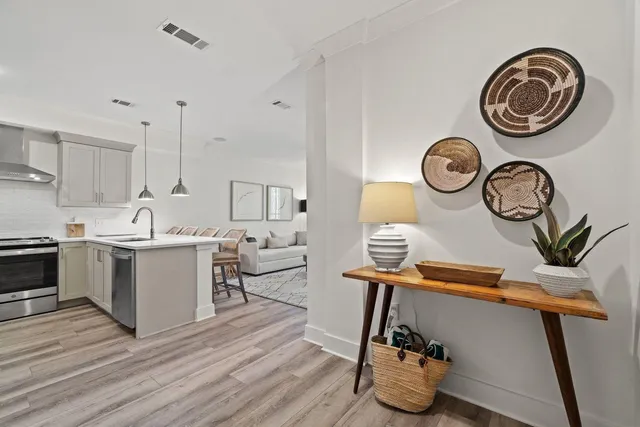 a kitchen with a sink and a stove