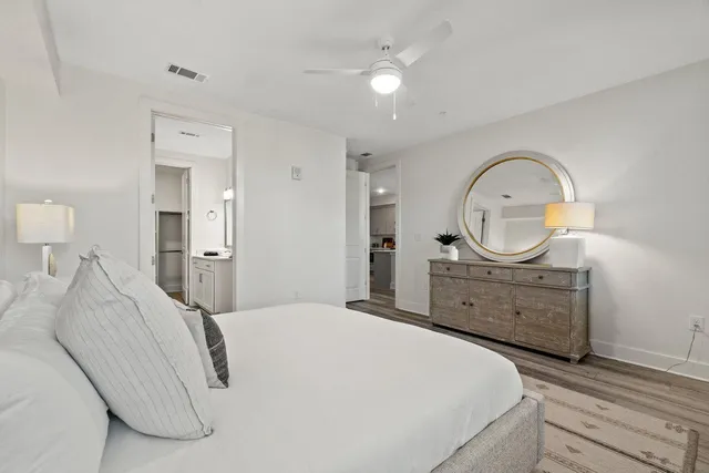 a bathroom with a tub sink a vanity and a mirror