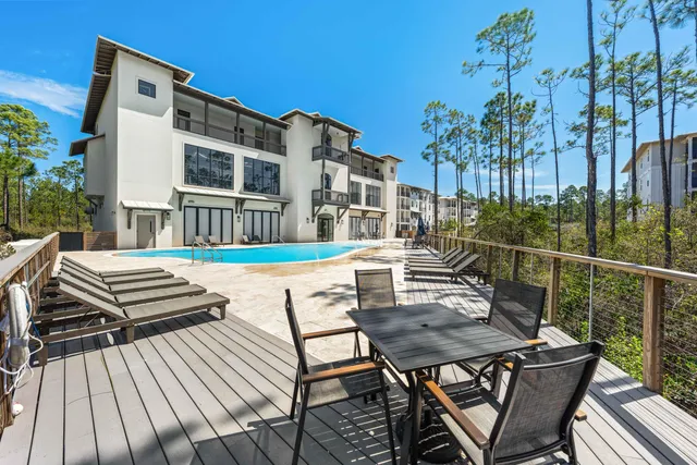 a view of a swimming pool with a yard