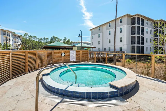 a gym room with gym equipment and a large window