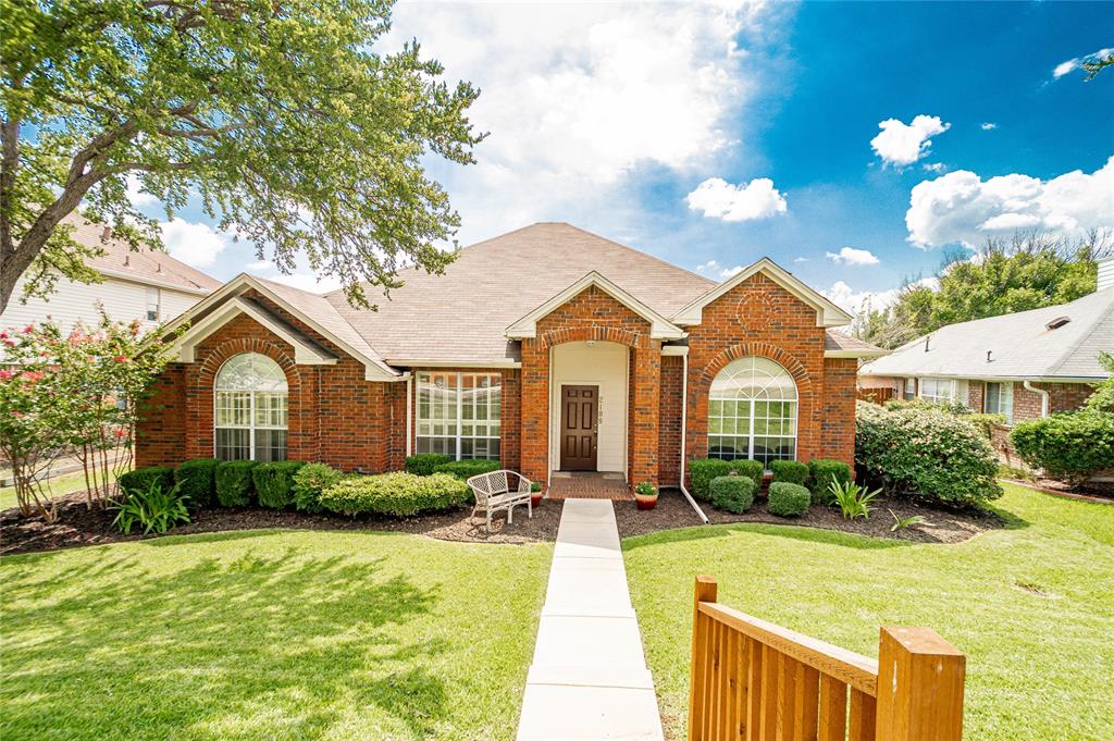 2108 Fawn Ridge Trail Carrollton, TX 75010 - Photo 1 of 1 a front view of house with yard and green space