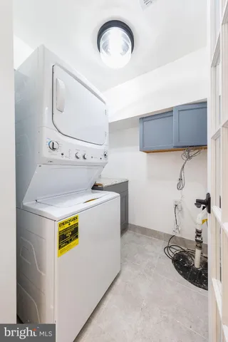 a bathroom with a double vanity sink a toilet and a mirror