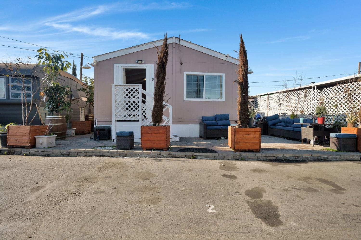 3707 Farmington Road, Unit 2 Stockton, CA 95215 - Photo 1 of 21 a view of a chairs and tables in the patio