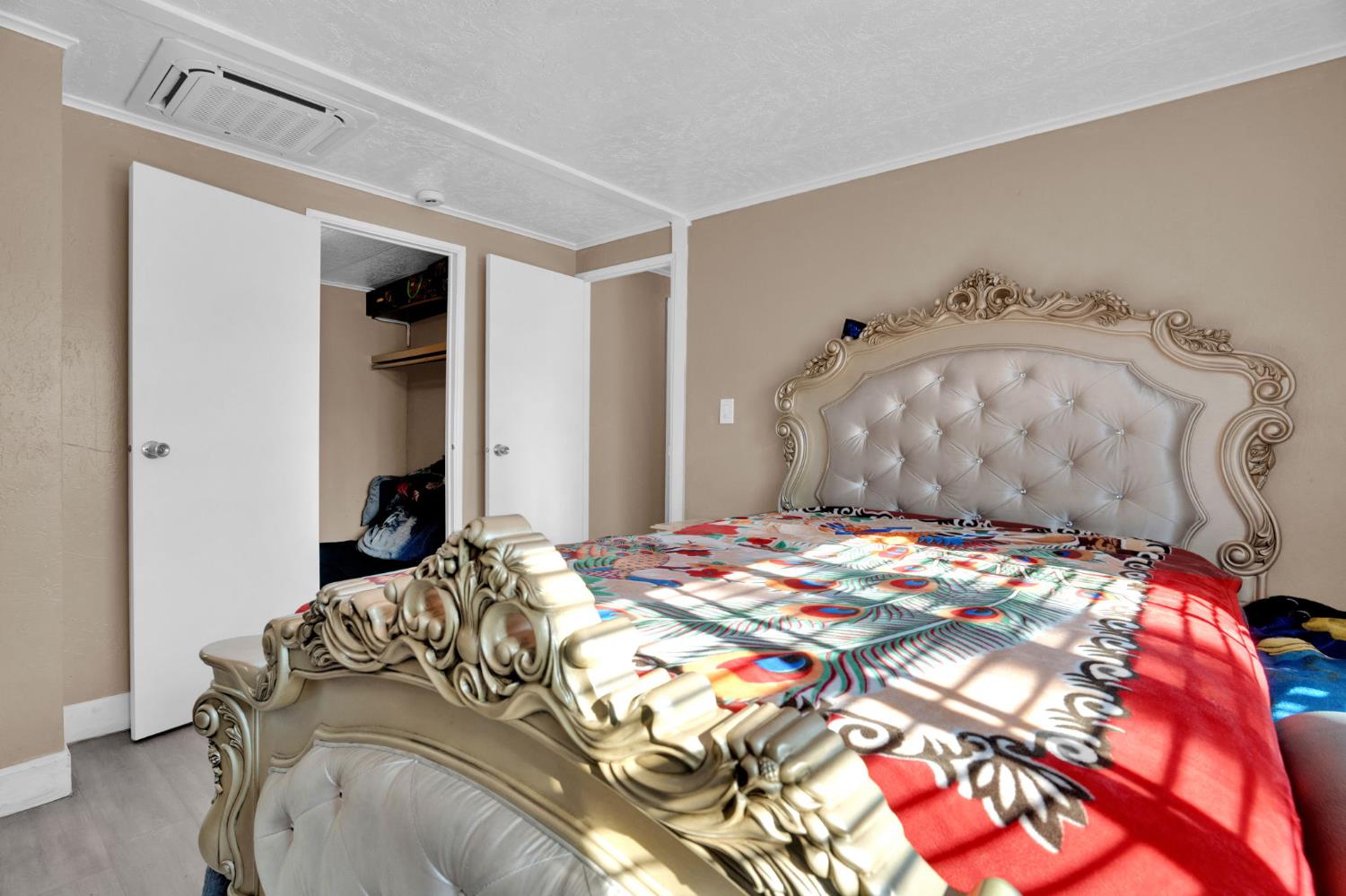 3707 Farmington Road, Unit 2 Stockton, CA 95215 - Photo 20 of 21 a bedroom with a bed and a mirror