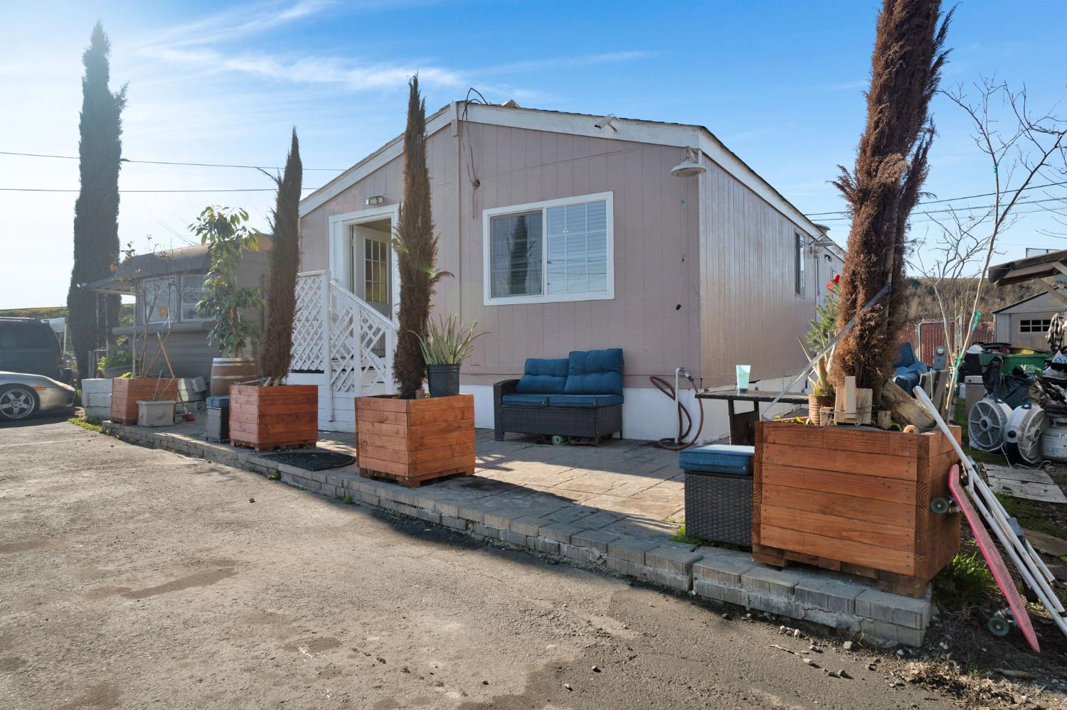 3707 Farmington Road, Unit 2 Stockton, CA 95215 - Photo 2 of 21 a backyard of a house with couches and a fire pit