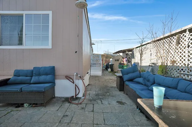 a living room with furniture and a rug